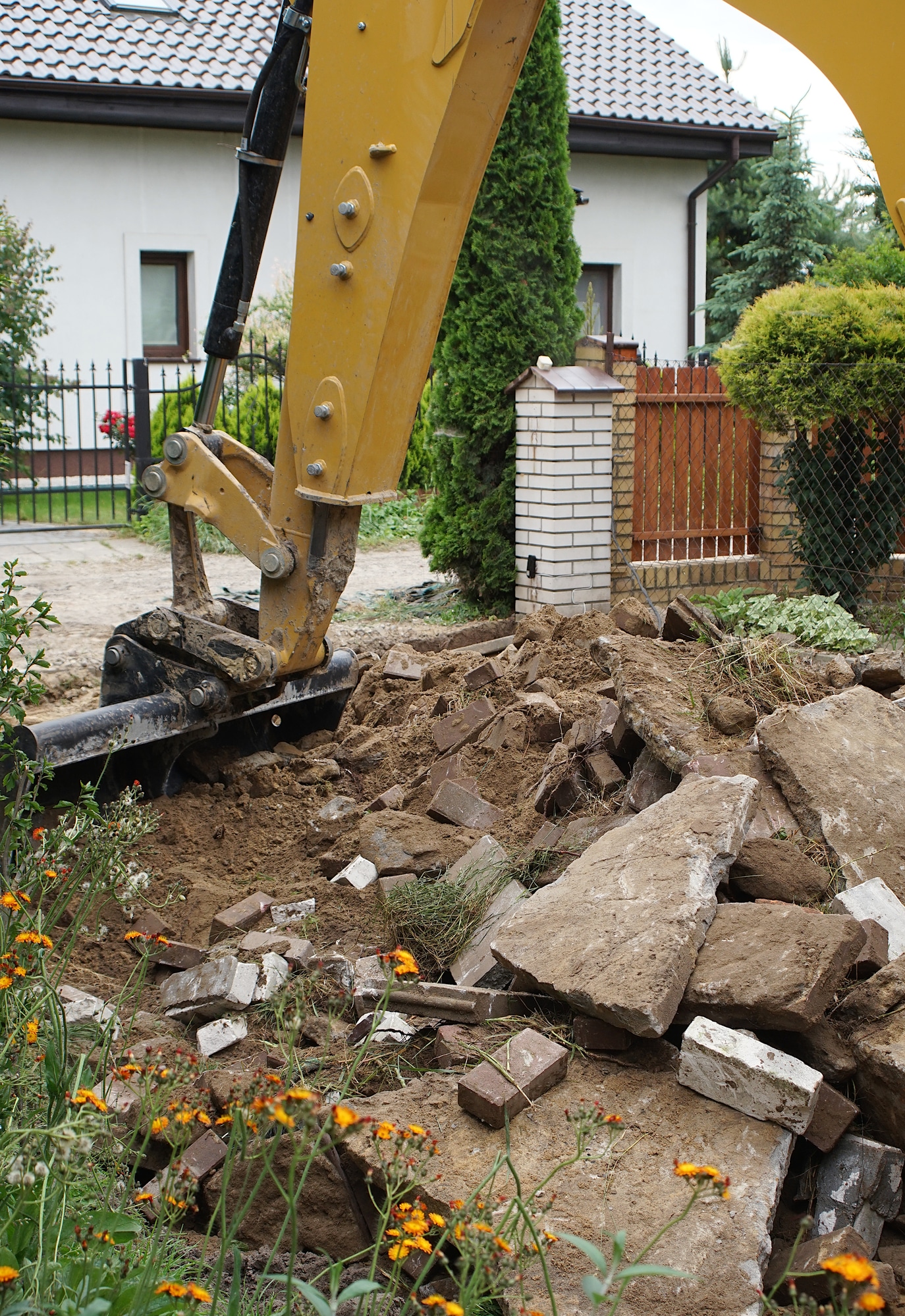Residential demolition contractor operating equipment in New Orleans
