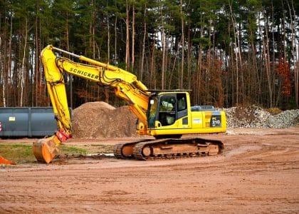 Excavator performing land clearing in New Orleans, Louisiana - TurnKey Demo Team