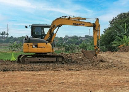 Excavator digging soil during site preparation in New Orleans
