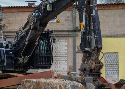 Excavator machine positioned at a demolition construction site