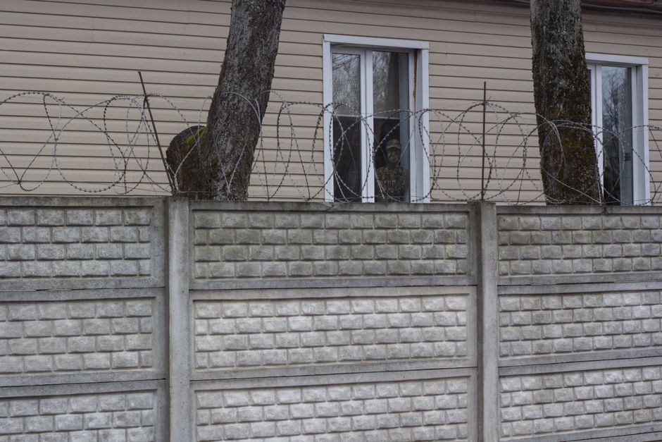 close-up photo documenting a shared fence line before demolition