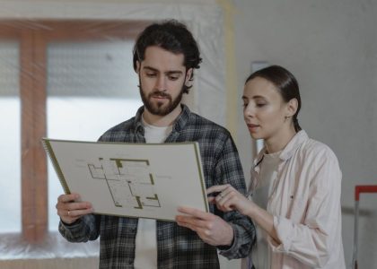 contractor reviewing a change order document at a demolition site