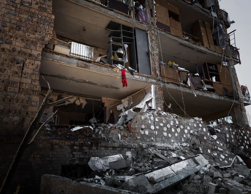 upper floor of a building being demolished with debris chute in place