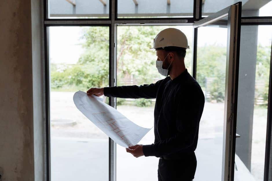 structural engineer reviewing plans for a multi-story demolition project