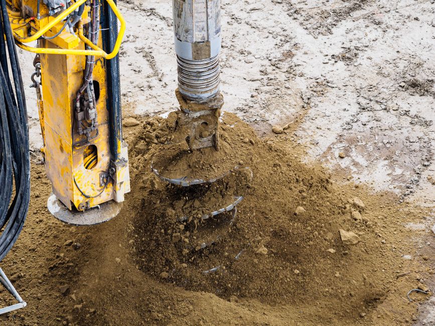 soil sample being collected near an excavated fuel tank