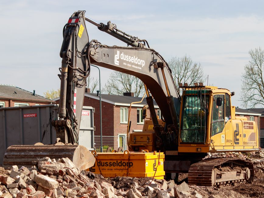 equipment operator running an excavator during a demolition project